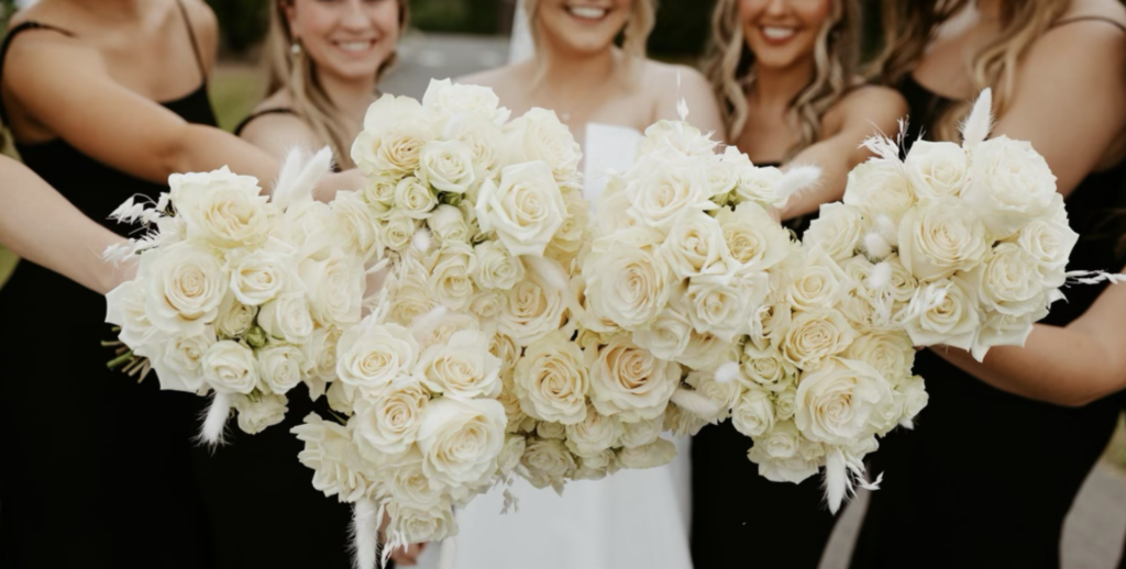 Luxury mountain wedding florals by Belle Leroux Studio at Ocoee Crest in Benton, Tennessee featuring romantic garden roses, textured greenery, and elegant reception design overlooking the Chattanooga and North Georgia mountains.