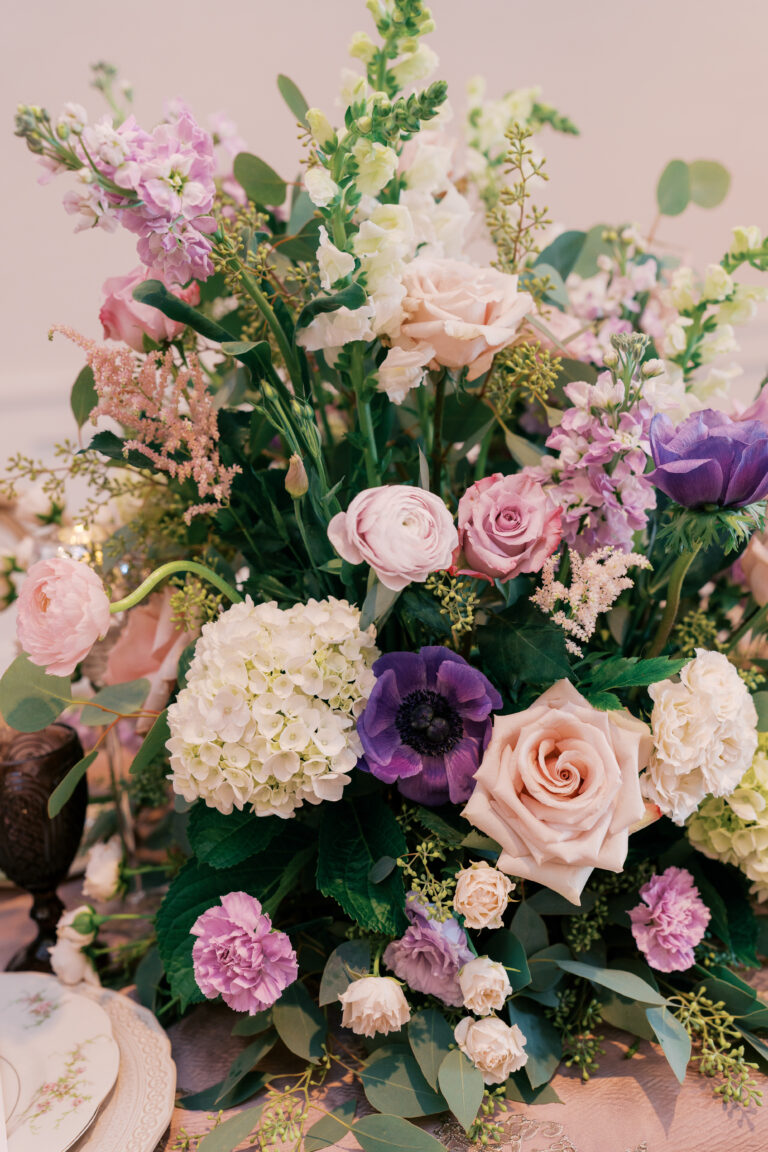 Luxury wedding reception floral tablescape designed and planned by an Atlanta partial wedding planning and design expert, featuring elevated florals, refined linens, and cohesive d&eacute;cor.
